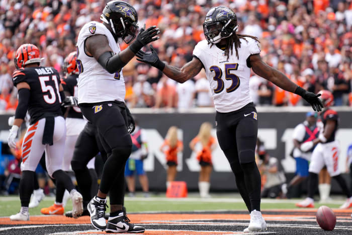 Baltimore Ravens running back Gus Edwards (35) celebrates a touchdown with Baltimore Ravens offensive tackle Morgan Moses (78) in the first quarter of a Week 2 NFL football game between the Baltimore Ravens and the Cincinnati Bengals Sunday, Sept. 17, 2023, at Paycor Stadium in Cincinnati.